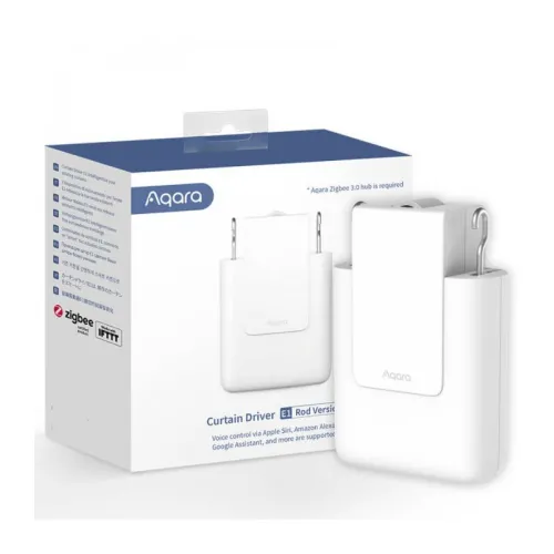 Na zdjęciu znajduje się biały napęd do zasłon Aqara E1 w wersji na karnisz, umieszczony przed opakowaniem z logo Aqara i informacjami o kompatybilności z systemami Apple Siri, Amazon Alexa i Google Assistant. Produkt ma nowoczesny, minimalistyczny design i jest przeznaczony do automatyzacji zasłon.