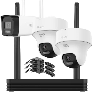 Zestaw do monitoringu Wi-Fi składa się z dwóch białych kamer kopułkowych, jednej kamery tubowej oraz rejestratora z antenami. Obok urządzeń znajdują się kable zasilające i adaptery.